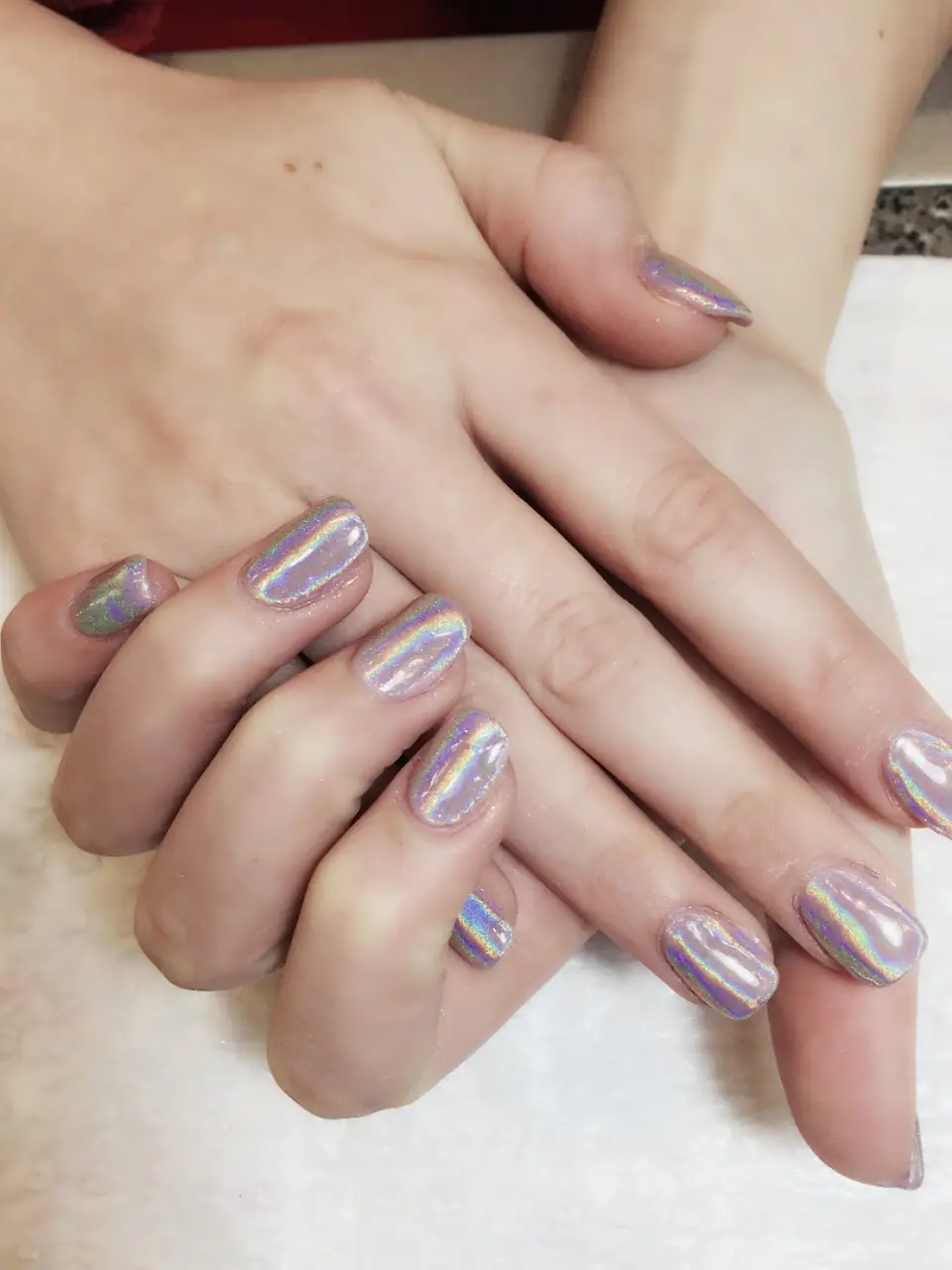 Holographic chrome nails done at Crown Nail Beauty, Camberwell